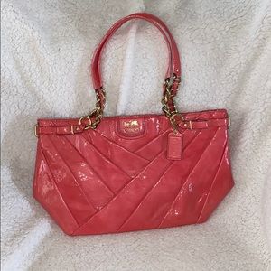 Hot pink coach purse with gold accents